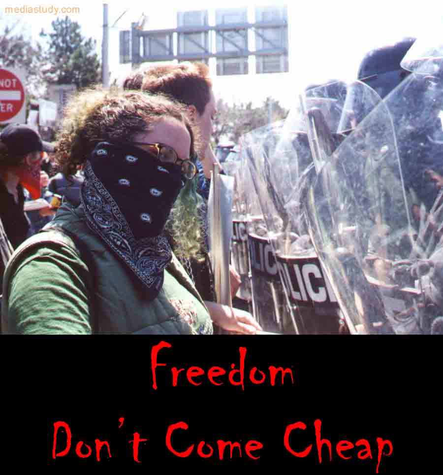 Photo Citizen vs. Riot Police with Caption: "Freedom Don't Come Cheap"